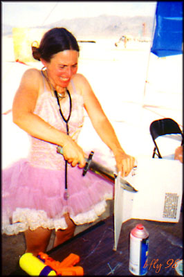 Girl in tutu slaughters box with Bowie knife.  Maybe she should just burn it.